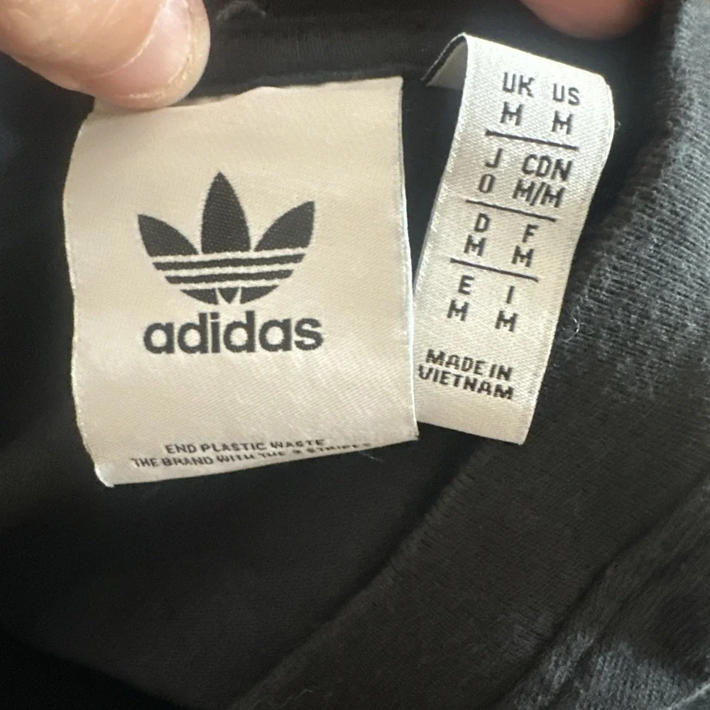 Adidas Adventure men's black graphic t-shirt‎ with Trefoil logo on chest.Size M